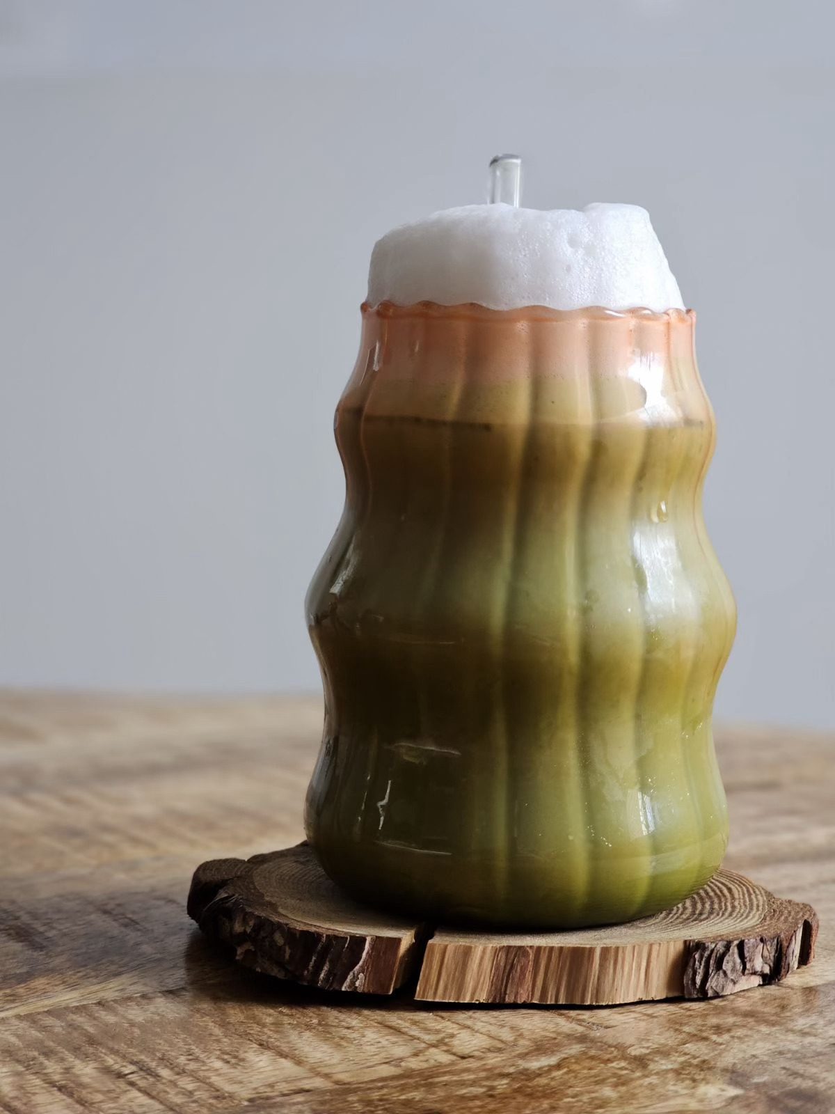 Iced matcha latte in a textured glass